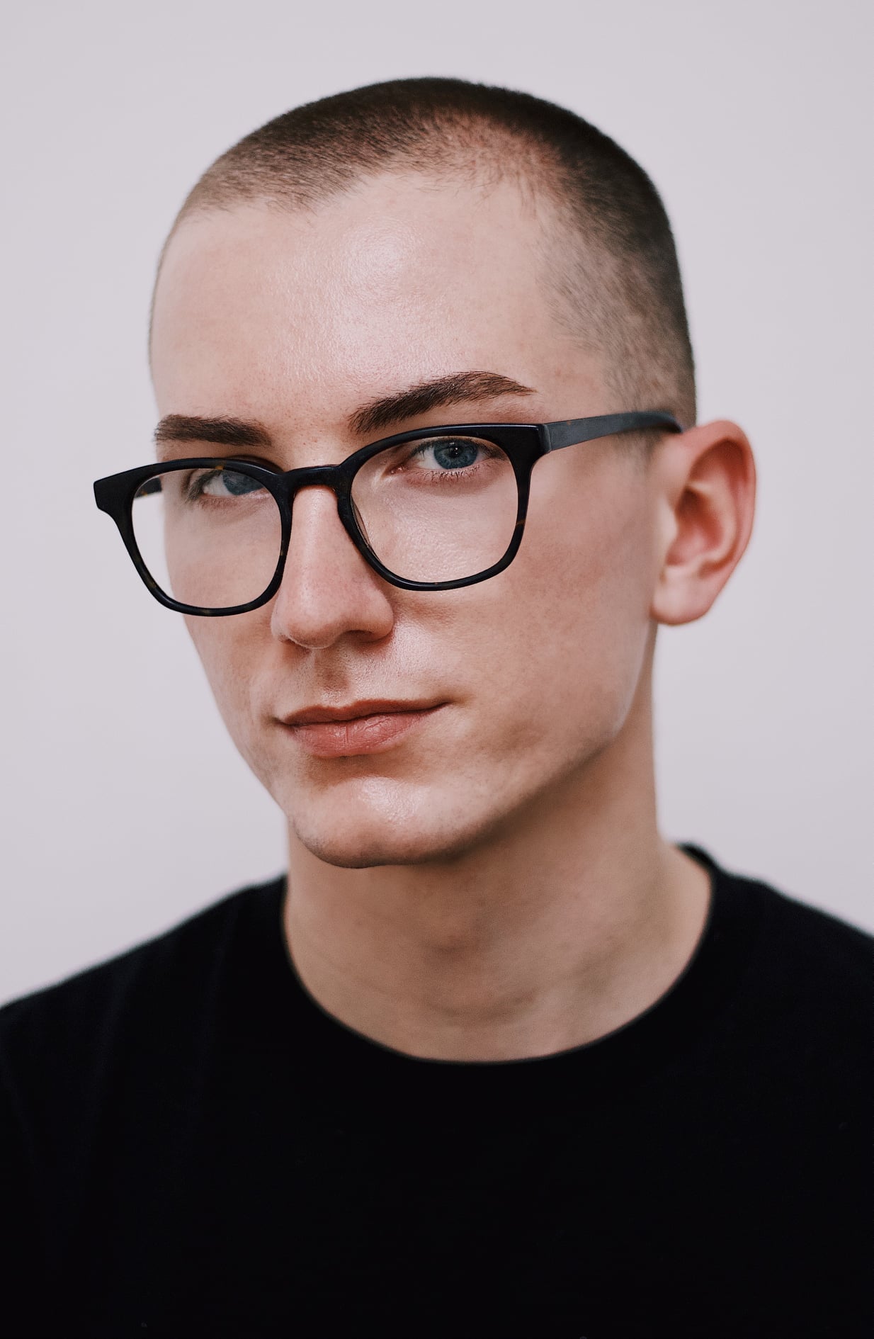 Robert Williams wearing a black t-shirt sitting in front of a white backdrop Robert Williams wearing a black t-shirt sitting in front of a white backdrop