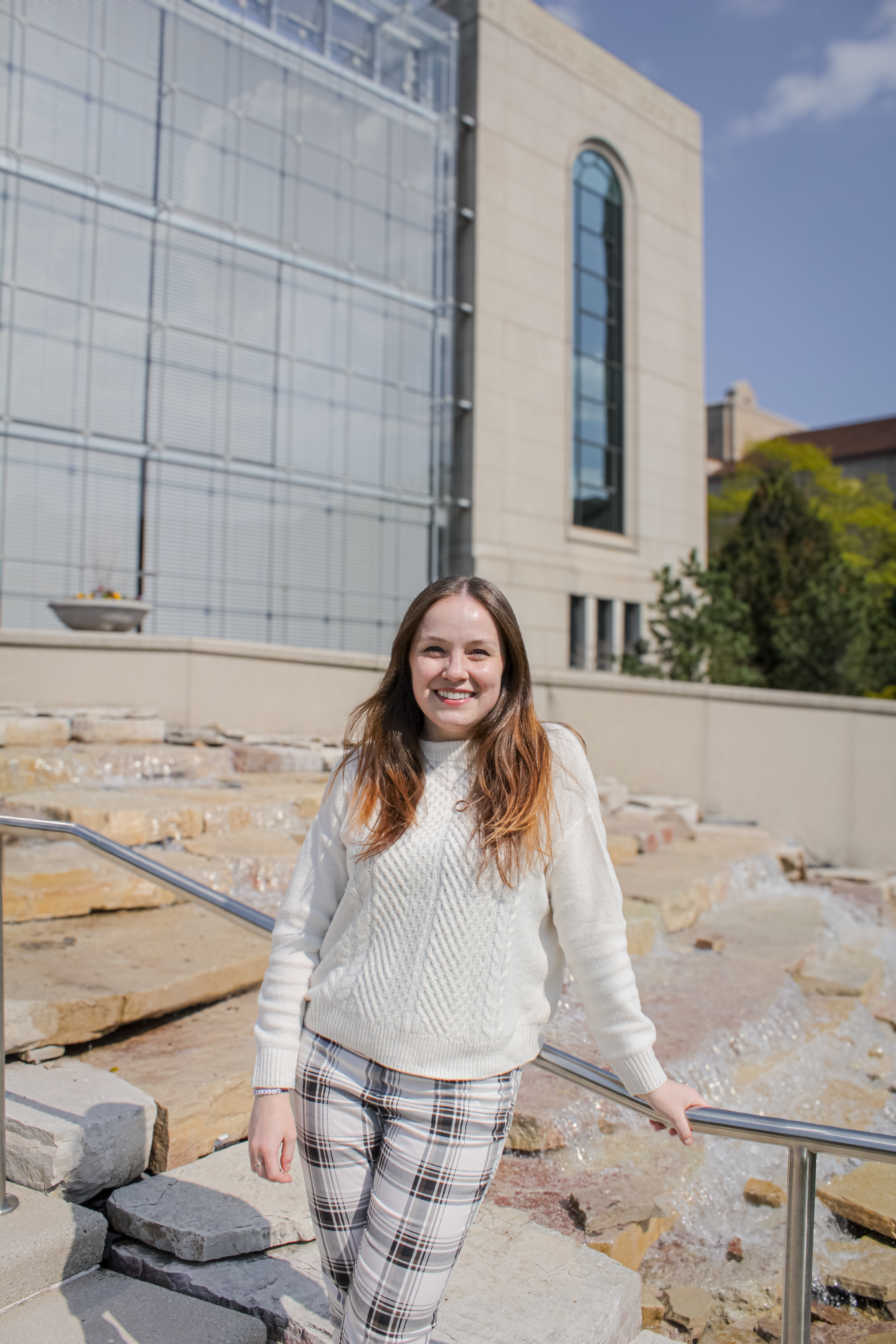 administrative assistant posing in front of Information Commons administrative assistant posing in front of Information Commons