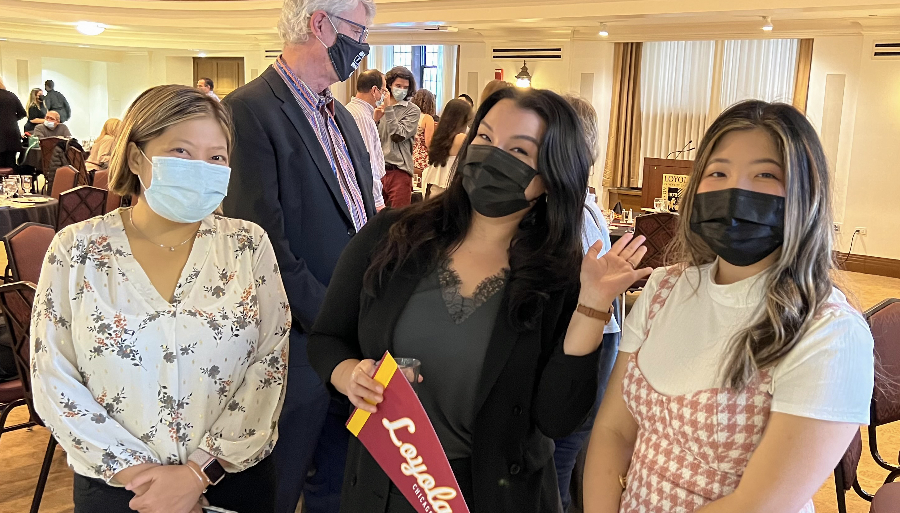SOC Assistant Professor Julia DeCook, center, celebrates with graduate Abbie Huynh, right, and her mother, Chuc Nguyen, left.    Photo by Sanjay Numbia