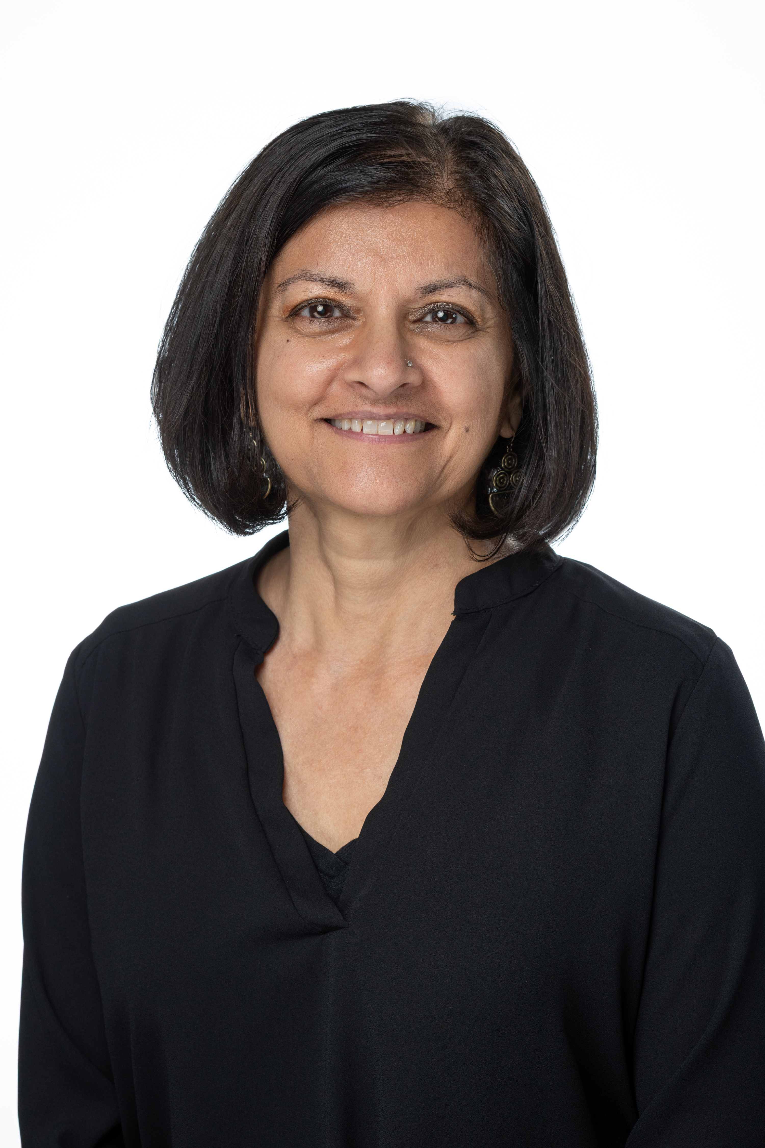 Portrait of Binita M. Donohue, MSW, LCSW, Clinical Assistant Professor, wearing a black blouse against a light background. Portrait of Binita M. Donohue, MSW, LCSW, Clinical Assistant Professor, wearing a black blouse against a light background.