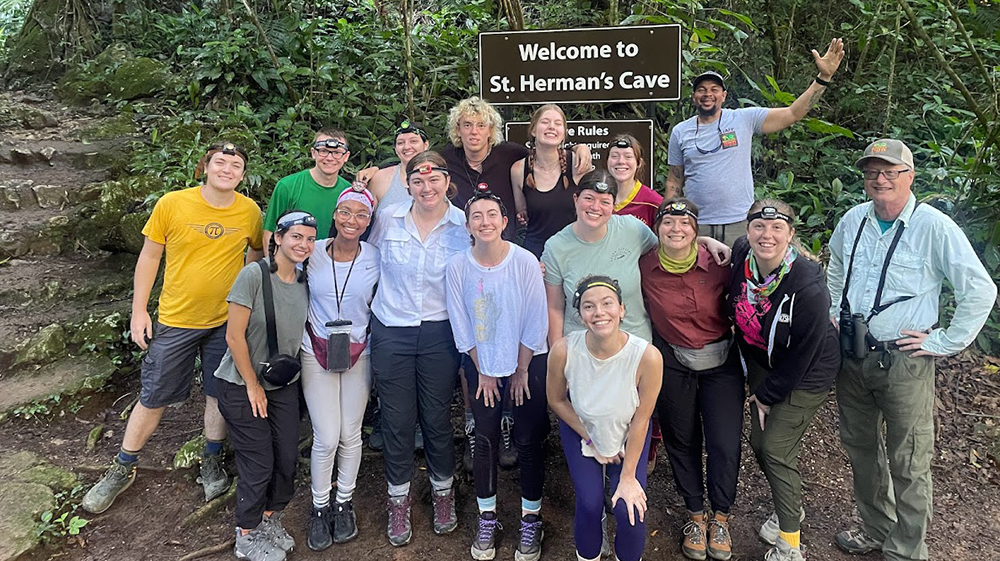 Students visiting Herman's Cave in Belize