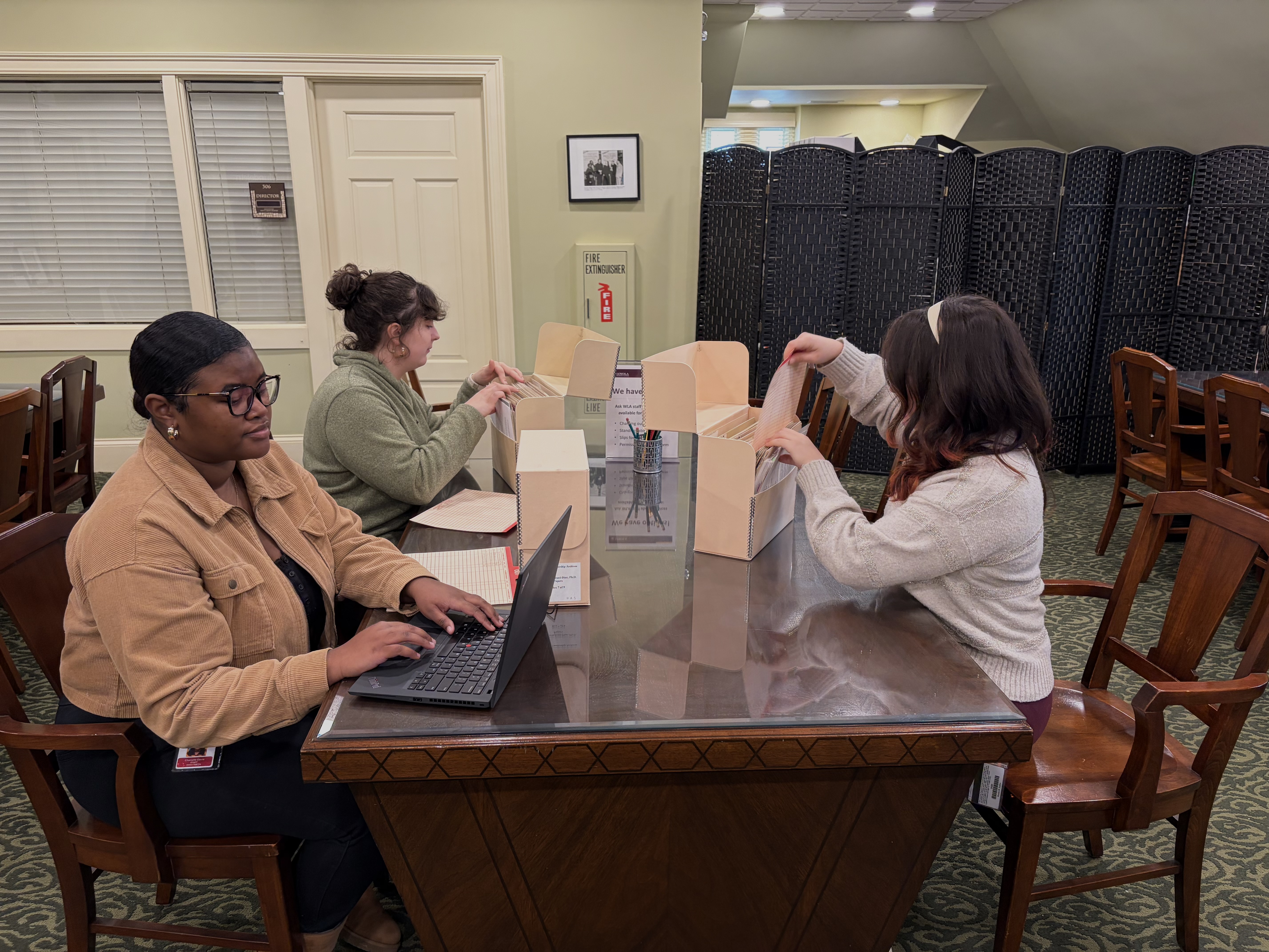 Researchers looking at archival materials in the WLA reading room Researchers looking at archival materials in the WLA reading room