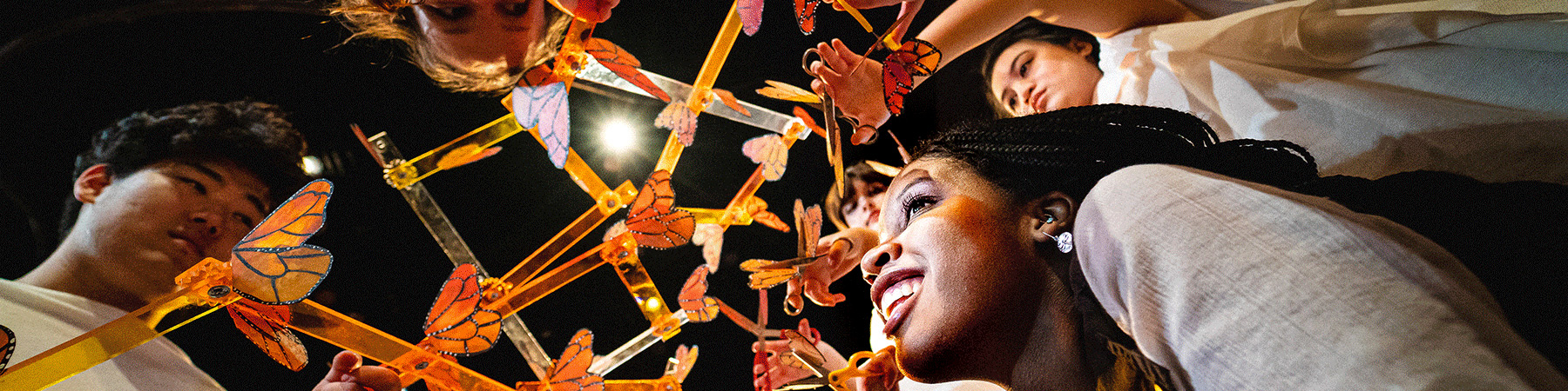 Loyola University Chicago students build an art piece involving items resembling butterflies Loyola University Chicago students build an art piece involving items resembling butterflies
