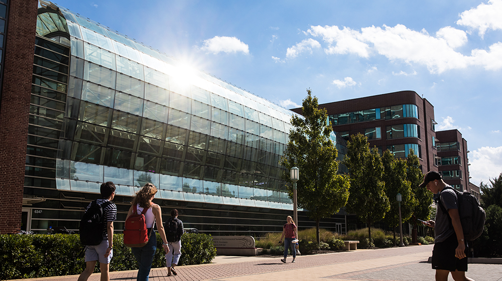 Exterior of the SES building with students walking by Exterior of the SES building with students walking by