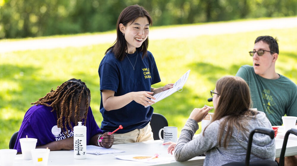 Esther Yun, a research assistant at Loyola's CHATS lab, guides participants through an intervention at Camp Independence Esther Yun, a research assistant at Loyola's CHATS lab, guides participants through an intervention at Camp Independence