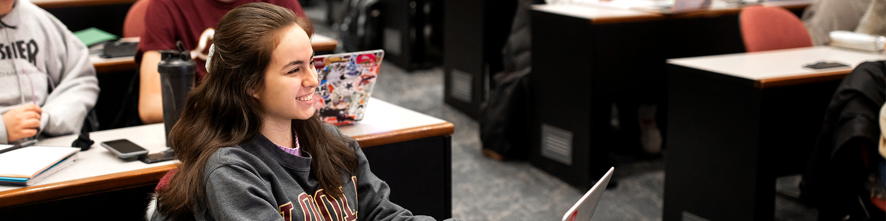 A Loyola University Chicago student attends a Psychology lecture A Loyola University Chicago student attends a Psychology lecture