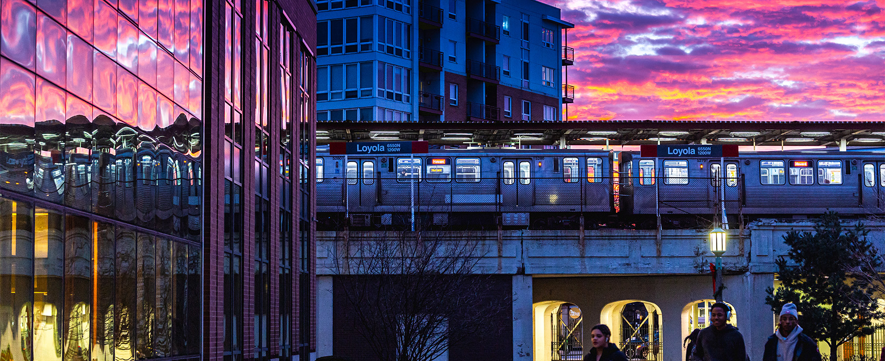 A winter sunset on Loyola's Lake Shore Campus outside the Damen Student Center