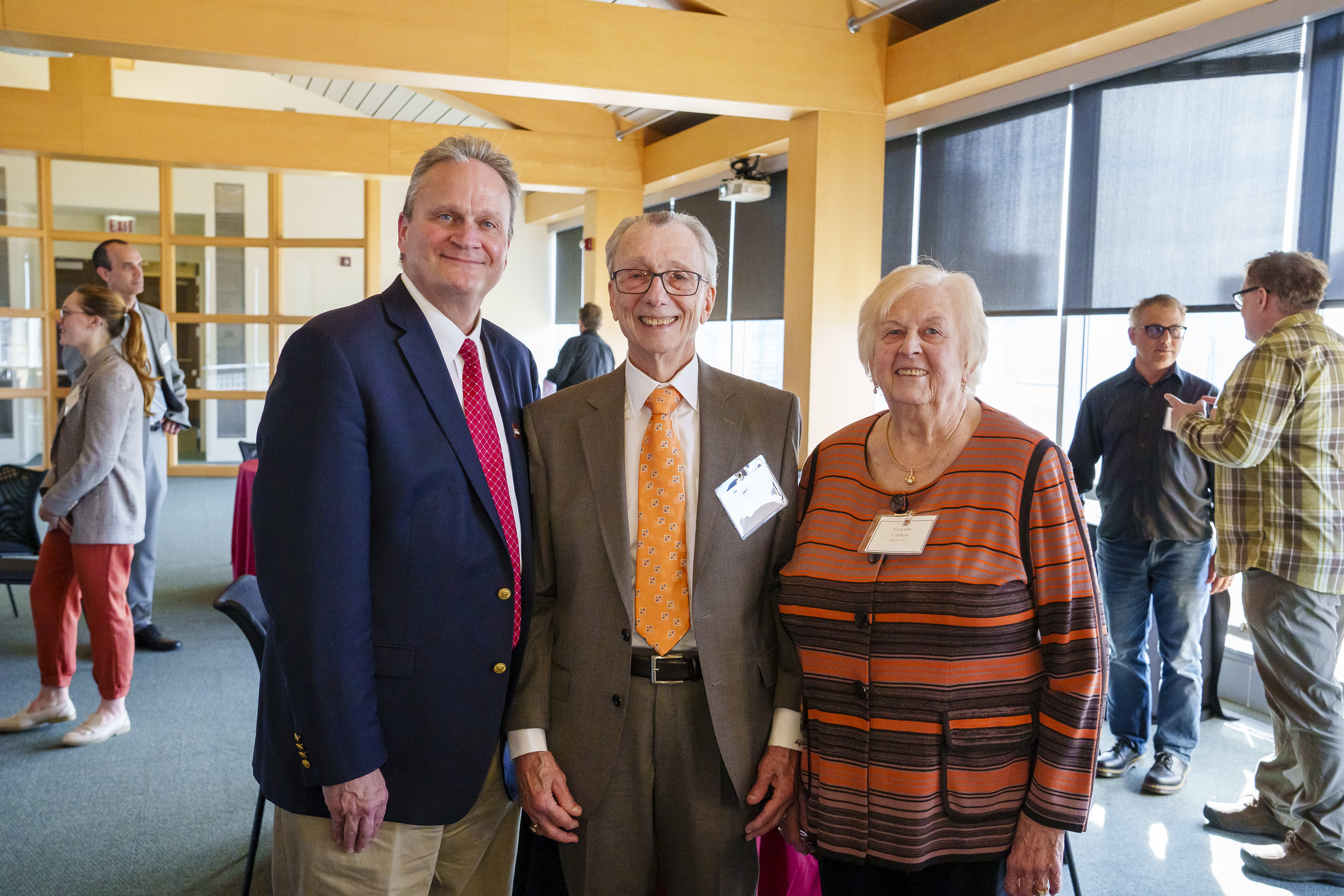 Dr. Michael and Mrs. Dorothy Carbon stand with Dean Peter J Schraeder