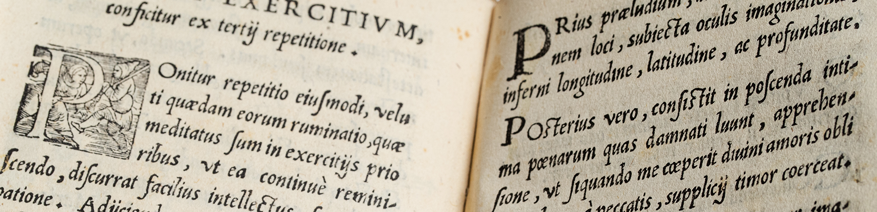 A close-up of two pages of a manuscript of St. Ignatius' spiritual exercises written in Latin