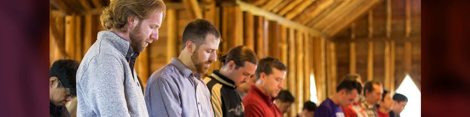 First Studies men in prayer in chapel at Omena villa.
