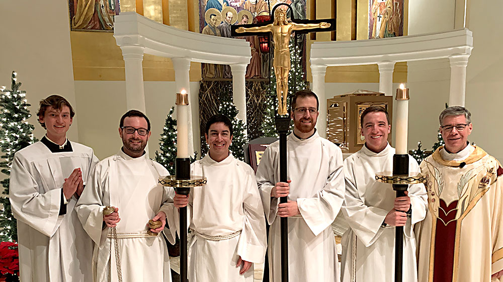 Several members of Loyola's Jesuit First Studies Program lead Midnight Mass.
