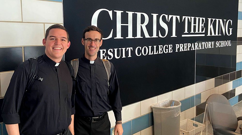 Two members the Jesuit First Studies group serve at Christ the King College Prep