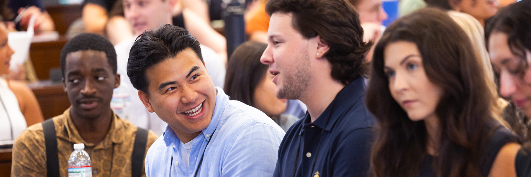 Loyola students converse during class