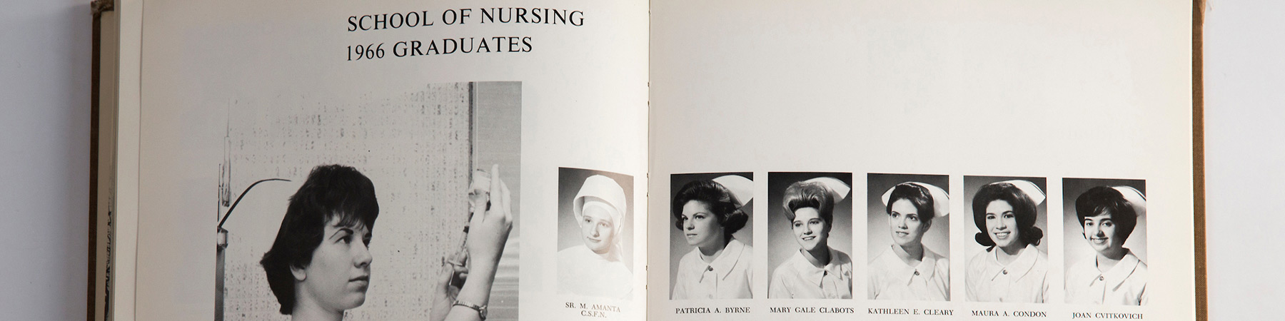 Photo of a yearbook from the graduating class of 1966 School of Nursing graduates