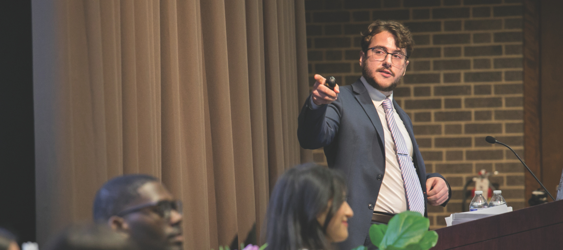 Student presenting at Loyola Stands Against Gun Violence Summit.