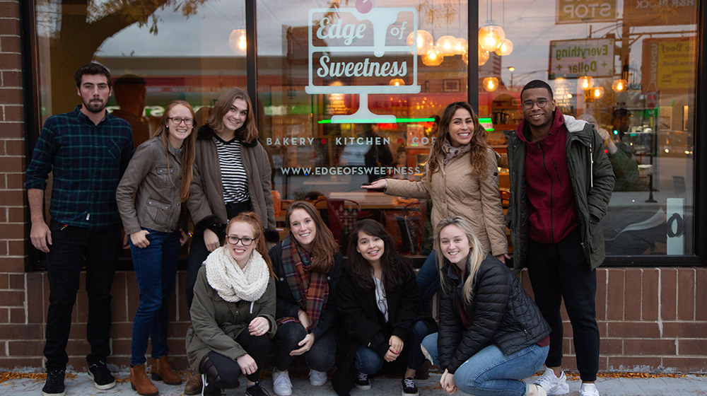 Students outside Edge of Sweetness Bakery in Edgewater 