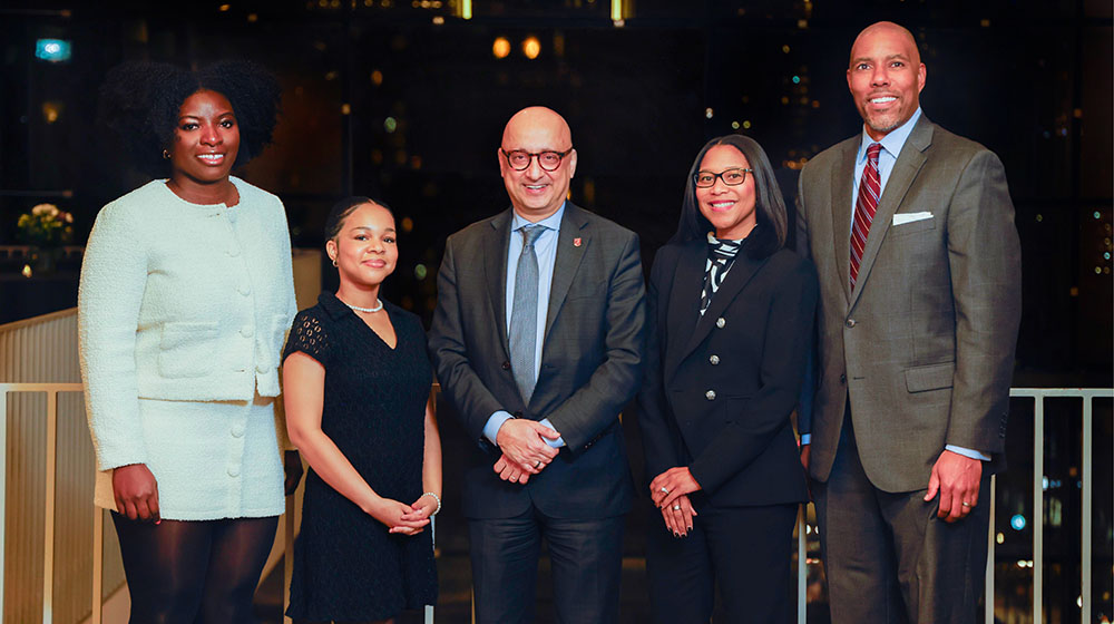 Winners of the 2025 Black Excellence Awards (left to right) Caitlin Osei, Martha Pierre-Lewis, Tracey Patterson and Steven Shaw stand with Quinlan Dean Michael Behnam (middle).