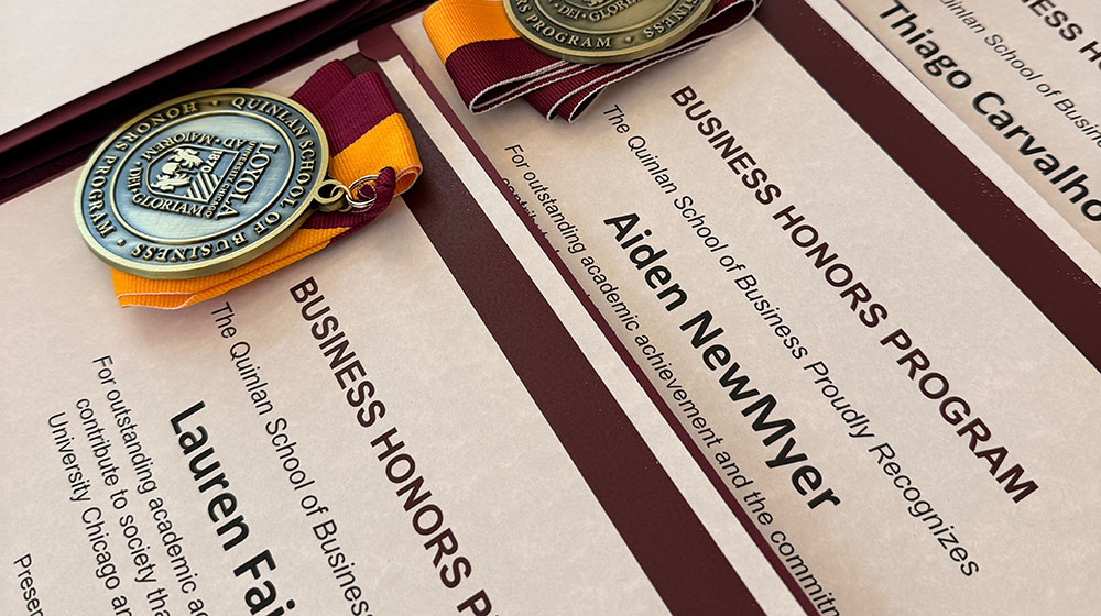 Medals presented to business honors students Medals presented to business honors students