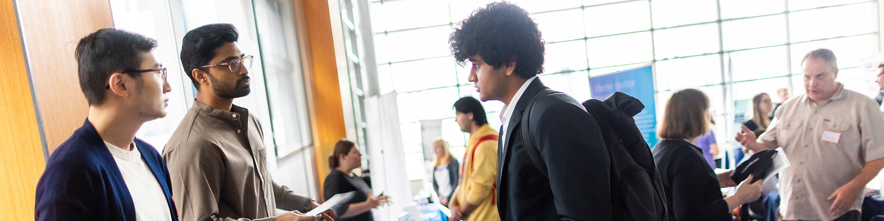 Quinlan student speaks with company representatives at an event