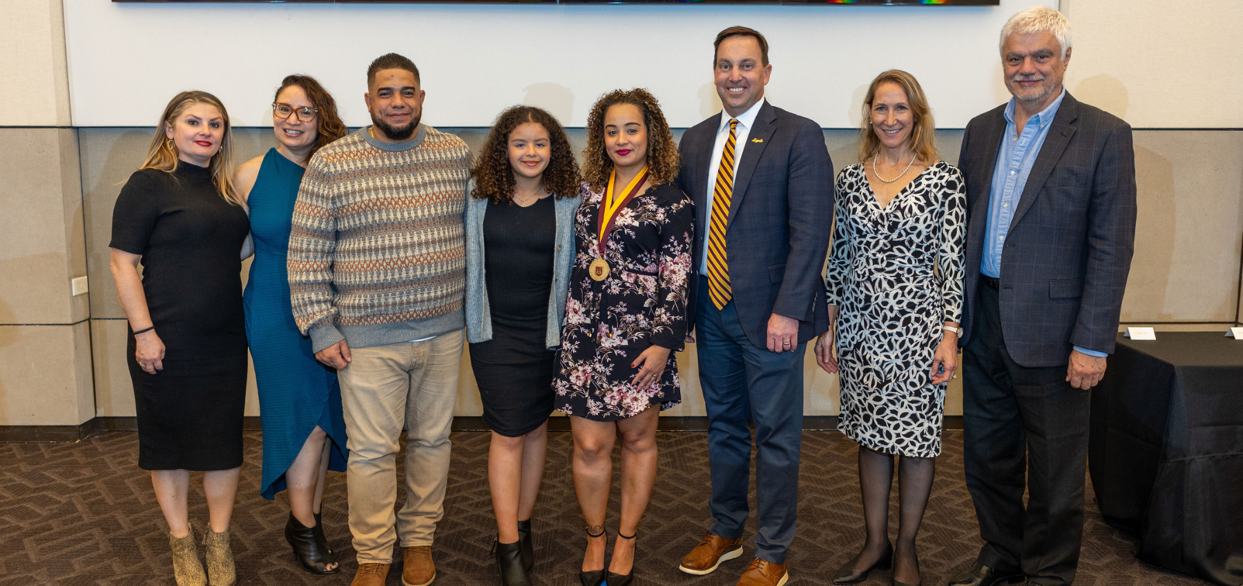 Loyola SCPS President's Medallion recipient, Chisa Santiago, with family