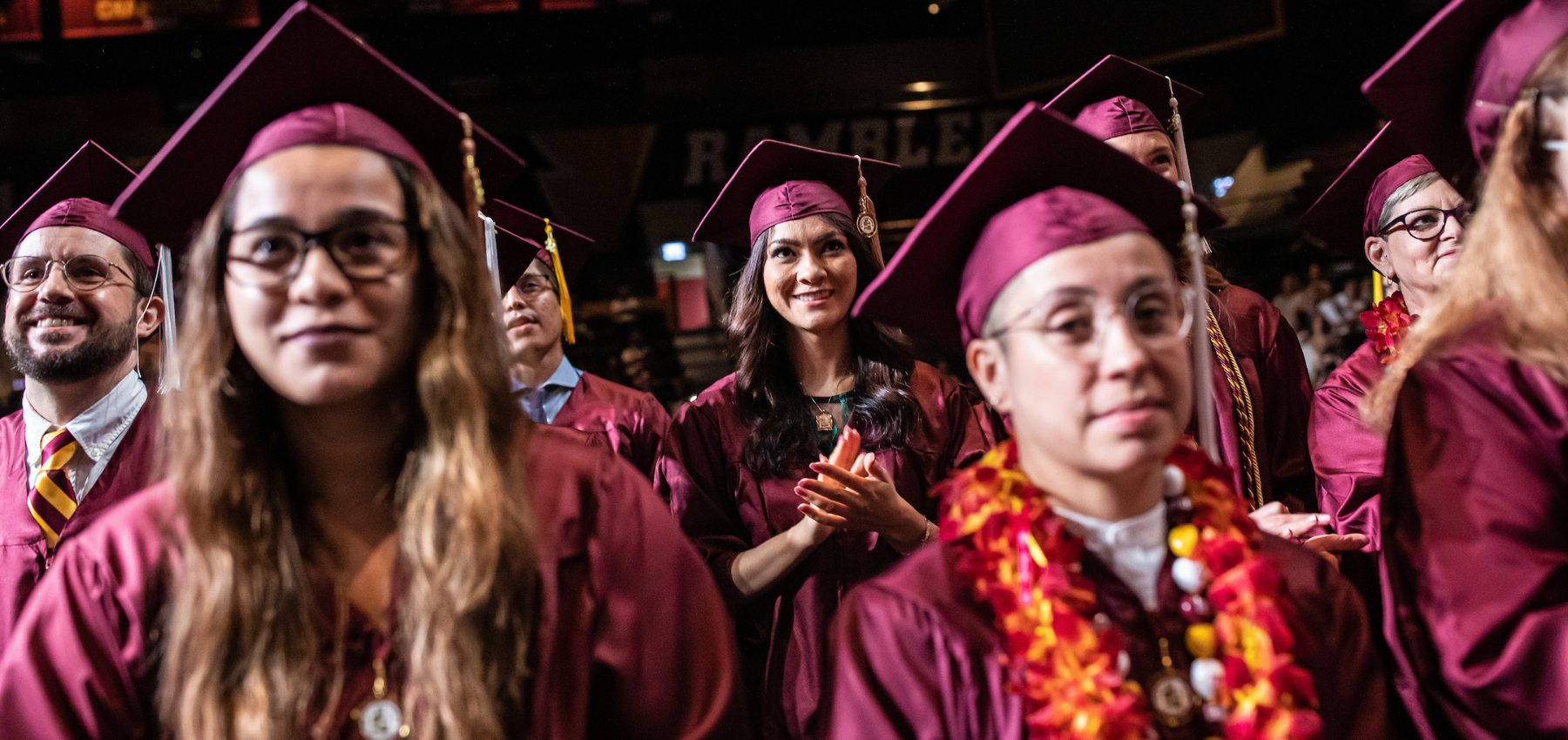Loyola SCPS graduates with their maroon cap and gown