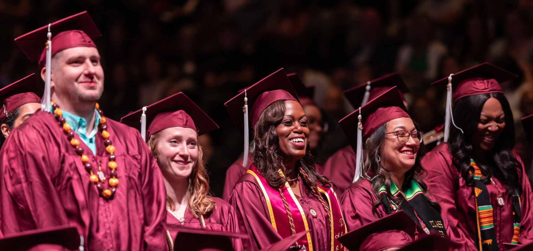 Loyola School of Continuing and Professional Studies graduates celebrating at commencement