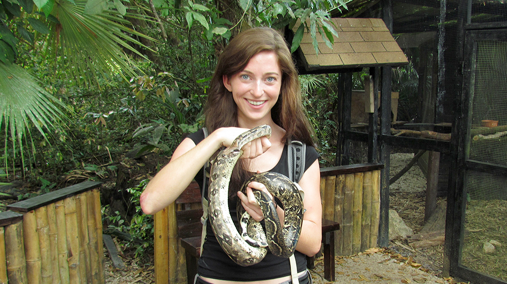 Monique Sosnowski holding a large snake