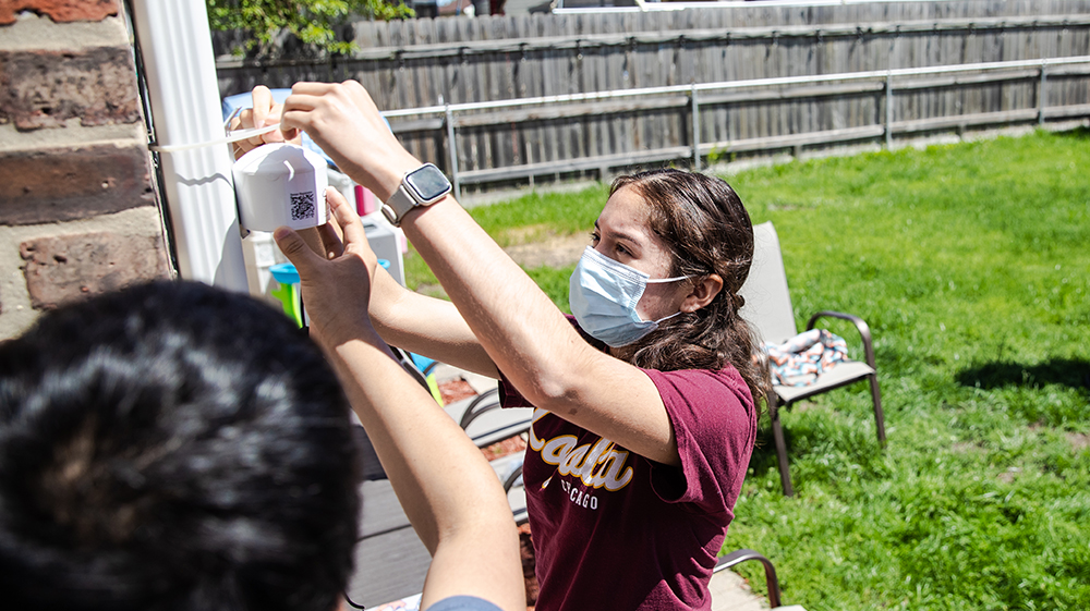 students installing air quality monitors