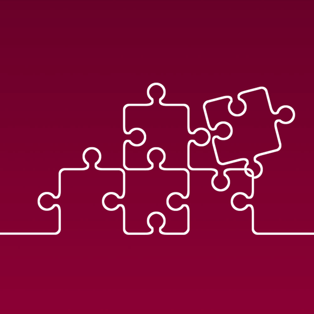 White line illustration of jigsaw puzzle pieces, against a maroon background, to represent Loyola's marketing and communication project management.