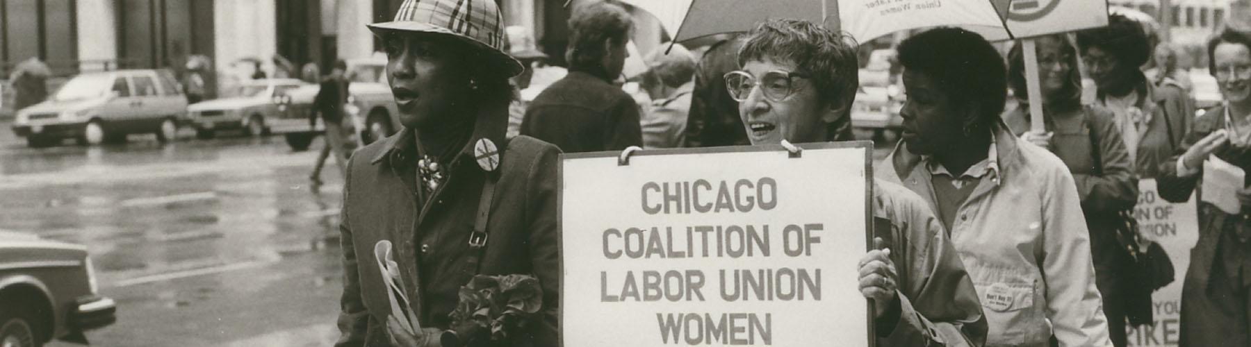 Women marching while holding up a sign for the Chicago Coalition of Labor Union Women