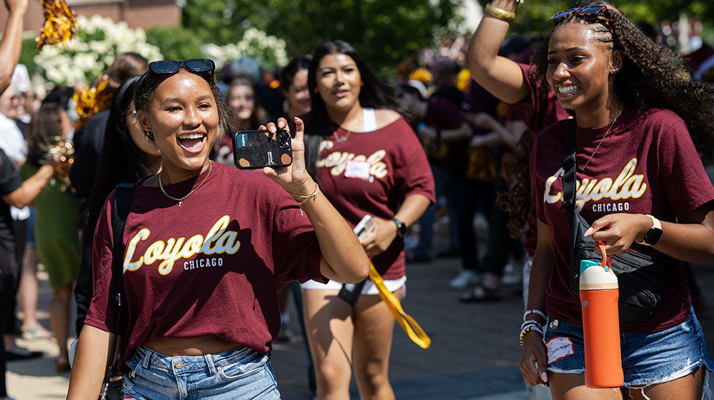 New students gather for New Student Convocation and parade through the Lake Shore campus. New students gather for New Student Convocation and parade through the Lake Shore campus.